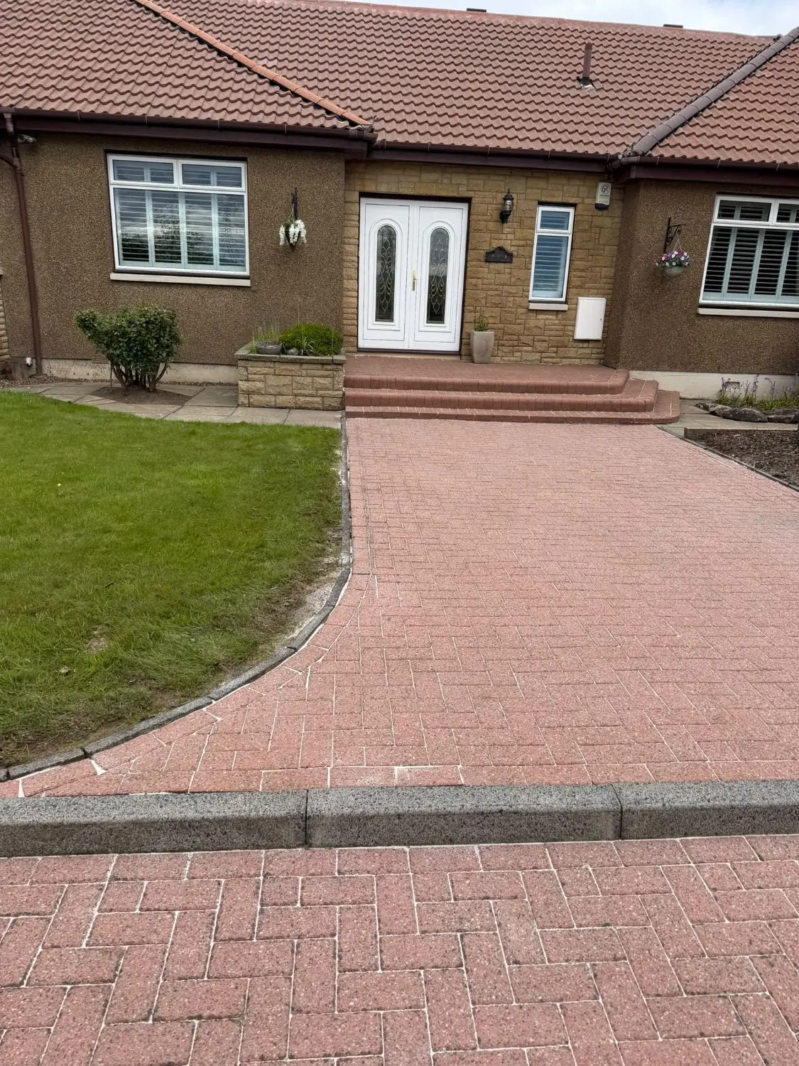 Block-paved path and steps leading to a front door